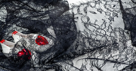 Black lace on a white background. Lace black drawing with flowers on a white background. Texture....