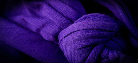 Texture, background, pattern. Fabric in blue braids. Knitted jersey background with a relief pattern. Braids in knitting.の写真素材