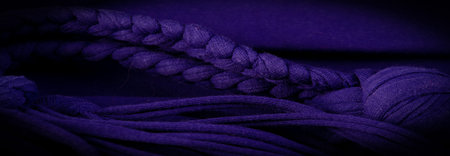 Texture, background, pattern. Fabric in blue braids. Knitted jersey background with a relief...