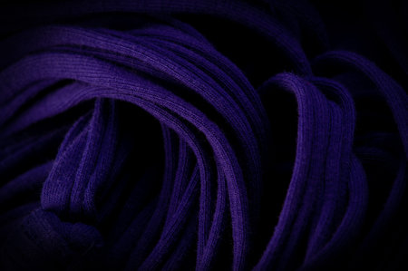 Texture, background, pattern. Fabric in blue braids. Knitted jersey background with a relief...