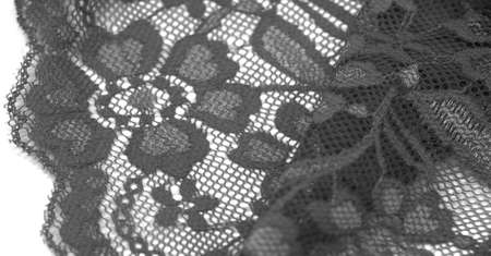 Black and white lace. This stunning and sophisticated fabric will be a true work of art. Intense Black with delicate lace patterns we love so much; unique, elegant and vibrant.の写真素材
