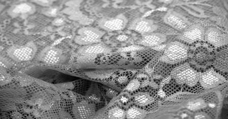 Black and white lace. This stunning and sophisticated fabric will be a true work of art. Intense Black with delicate lace patterns we love so much; unique, elegant and vibrant.の写真素材