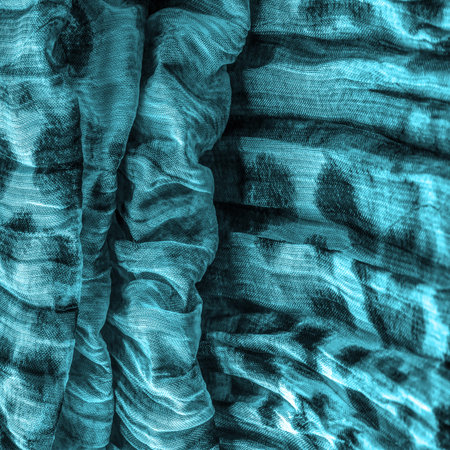 Blue fabric. Silk fabric in fine organza with panther print, Crumpled texture. Background. Template.
