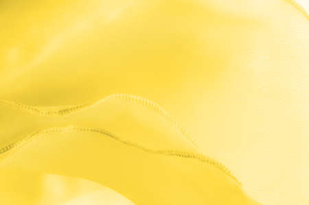 Texture. Template. yellow amber silk, banner or cover design. luxury textile decor poster background, yellow drapery material with soft wavy waves, posterの写真素材
