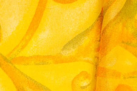 Texture, Pattern. Smooth elegant yellow fabric texture with abstract red print. luxury as abstract background. Luxury Christmas background. Fabric, delicate.の写真素材