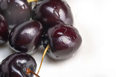 Photo of food. Sweet cherry on white isolated background. fresh cherries with stems and leaves, berry pickの写真素材