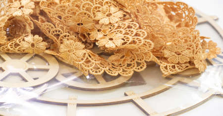 Lace ribbon, gold yellow. A stunningly patterned ribbon can be the perfect decoration for your special occasion! If you want design, dazzling tabletop displays, ribbon-wrapped bouquets, luxury decorの写真素材