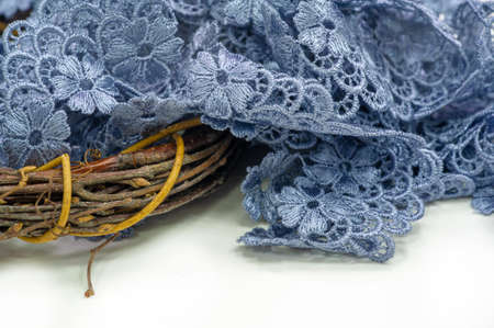 Gray-blue lace ribbon. wide floral pattern, colorful lace fabric, gift wrapping and flower decorationの写真素材