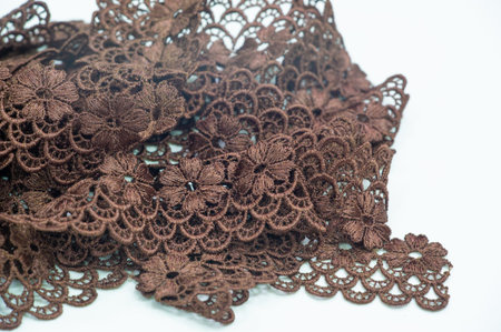 Brown lace ribbon. This ribbon is used in crafts and design, decorating your projects, gift...