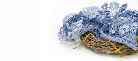 Gray-blue lace ribbon. wide floral pattern, colorful lace fabric, gift wrapping and flower decorationの写真素材