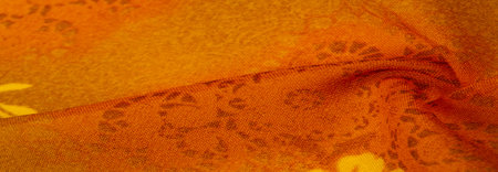 Texture, background, design. Orange fabric with painted floral patterns. floral botanical flowers....
