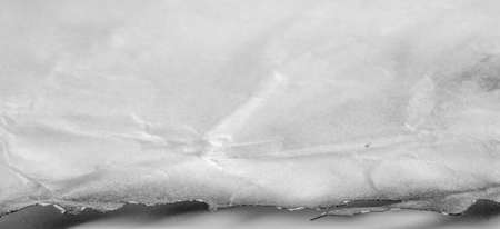 Background design texture, durable old paper; not new anymore. material made from wood pulp or other fibrous substances, used for writing, drawing or printing or as a wrapping material.の写真素材