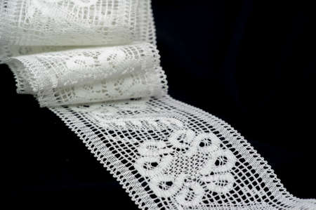 lace fabric. Embroidered fabric set. Close-up, lace decoration with ribbons, embroidered flower braid for design, projects, edgingの写真素材