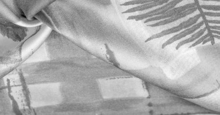 Black and white fabric with an abstract pattern, a print of branches with leaves of flora....