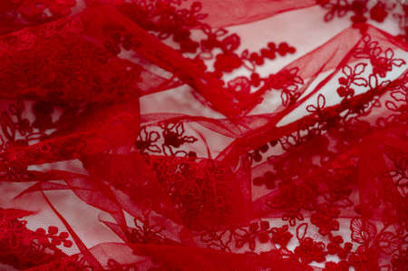 Colored red lace fabric. Vintage. Flowers background in Provence style. Decorative ornament background for fabric, textile, wrapping paper, cards, invitations, wallpaper, web design.の写真素材