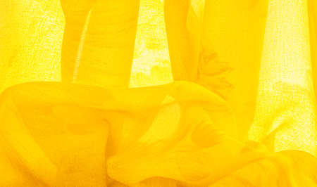 yellow silk fabric with painted meadow flowers, floral background. Many pale flowers in a colorful composition. Background textureの写真素材