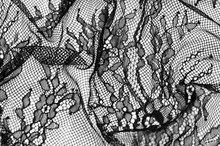 Black lace fabric. Vintage floral background. dark black vintage old floral laceの写真素材