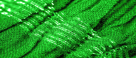 Green silk fabric. Shirred fabrics, fabrics with parallel or diagonal folds with serrated folds.