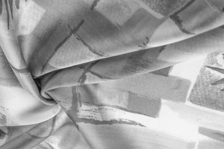 Black and white fabric with an abstract pattern, a print of branches with leaves of flora....