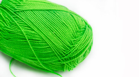 Sewing Sewing products. Roll of green wool yarn. This yarn has a great color and is suitable for crocheting, knitting and braiding.の写真素材