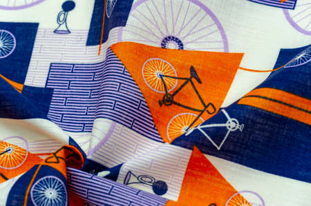 Cotton fabric, blue, yellow and white geometric shapes. With a drawn cycling theme, retro pattern. abstract mixing of bike partsの写真素材