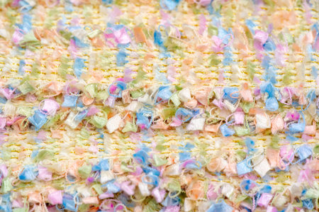 lace fabric. Multi-colored beads with pom-poms Fringe Tassels. Close-up, Pearl trim, Sewing mesh,...