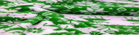 Velvet. Plush. For winter wear. Snow deer, snowflakes. Green and white tones. Silk fabric with soft,...