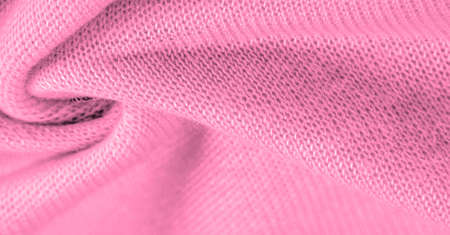 Pink wool, wool from a sheep, goat or similar animal, especially when used in the manufacture of fabric or yarn. Background texture, pattern,の写真素材