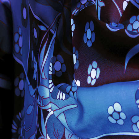 brown-blue fabric with a print of white flowers, geometric lines. Texture, background, patternの写真素材