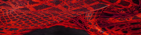 red background from textile material. lace fabric. Natural ruby texture. Texture, background,...
