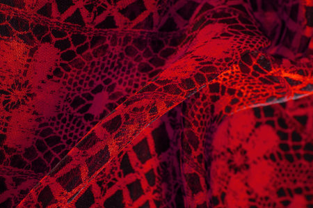 red background from textile material. lace fabric. Natural ruby texture. Texture, background,...