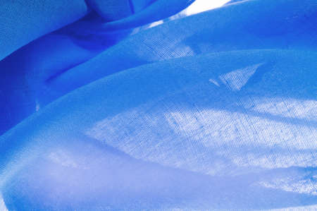 navy blue silk texture, blue fine grain fabric. desktop product, display perspective, studio photography. product demo banner.の写真素材