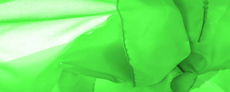 green silk fabric, beautiful smooth elegant, wavy, green satin silk luxury fabric, abstract design. background texture, patternの写真素材