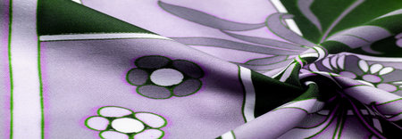 Green blue fabric with print of white flowers, geometric lines. Introduces a new modern color...