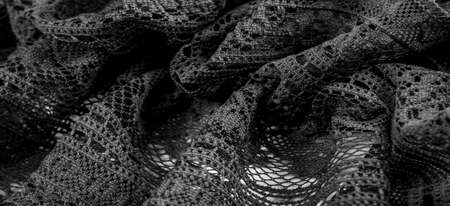 black lace fabric, sexy retro negligee material. Vintage lingerie ornament. background texture, pattern.の写真素材
