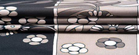 Texture, background, pattern, black silk with a print of white flowers, geometric lines. Introduces...