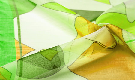 fine knitted fabric - light transparent, green, white and yellow geometric colors, similar to a veil...