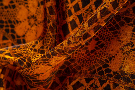brown lace fabric, combination of amber with black fabric. amber, texture, background, pattern.