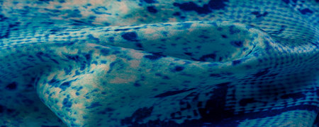 blue fabric with snakeskin pattern, background texture of bright blue fabric close up. background,...
