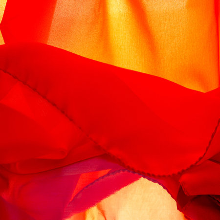 red silk fabric, ruby satin silk fabric, texture background, macro. abstract design.