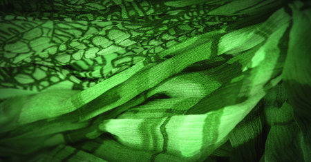 Dark green silk fabric, floral pattern. Wavy corrugation. Fine wave on the surface of the fabric. Background texture, decorative ornamentの写真素材