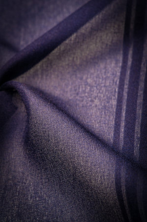 Silk fabric with blue stripes. Abstract silk tones in sapphire tones. Vintage pattern on the fabric....
