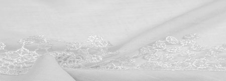 Spring white silk with lace capes. Sleek, elegant white silk or luxe satin can be used as an abstract background. Background texture, postcard templateの写真素材