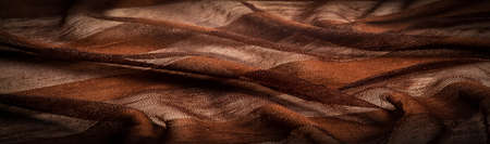 Texture, background, design, light transparent silk fabric in brown, Soft-touch material is available in a rainbow of colors to blend with the latest developments of your projectsの写真素材