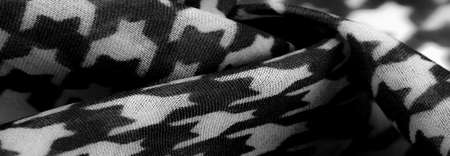 Delicate black and white silk chiffon in bright colors with geometric print. Surprisingly light, smooth, sandy to the touch fabric.の写真素材