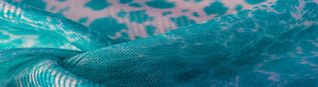 The texture, background, pattern, green white silk fabric is textile. Its properties differ from woven material in that it is more flexible and simple in design.の写真素材