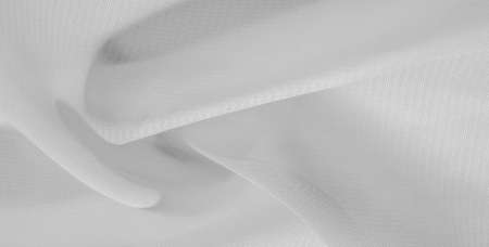 white silk fabric. This silk organza has a gentle open weave. Use this luxurious fabric for anything from your design for special occasions to creatiの写真素材