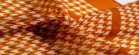 tissue, textile, cloth, texture. Delicate brown silk chiffon in vibrant colors with geometric print....