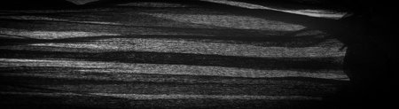 Black crepe is a fabric made of silk, wool or synthetic fibers with a distinctly crisp, ruffled appearance. Texture, background, patternの写真素材