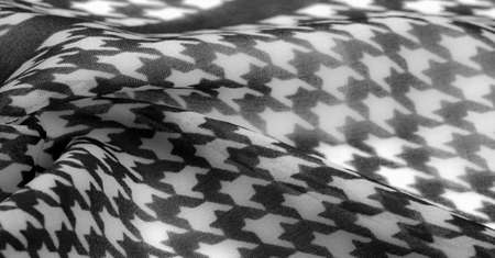 Delicate black and white silk chiffon in bright colors with geometric print. Surprisingly light, smooth, sandy to the touch fabric. One of the most elの写真素材